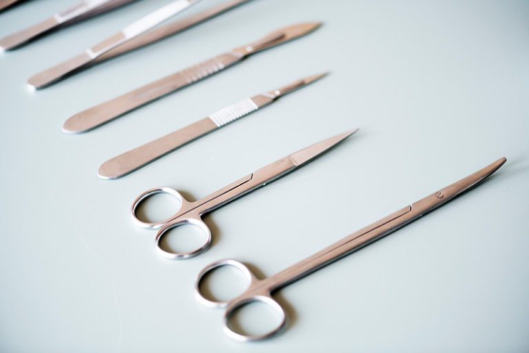 Closeup of surgery knives set isolated