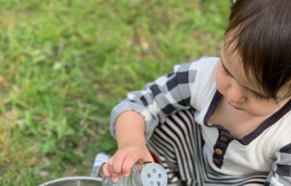 child making "soup" outside