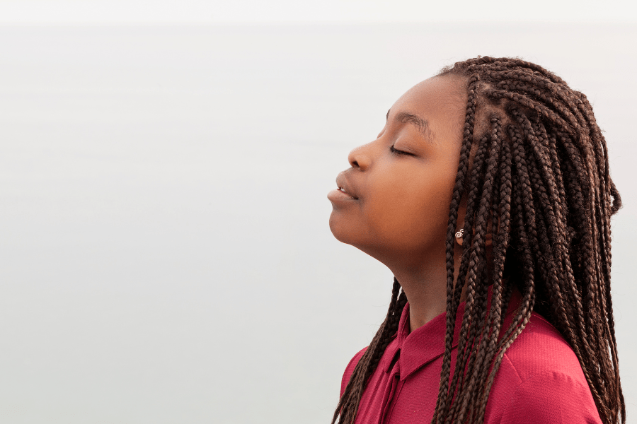 Black child breathes in deeply