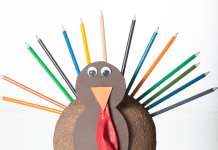 Easy Thanksgiving craft turkey made from color pencils, construction paper, and googly eyes.