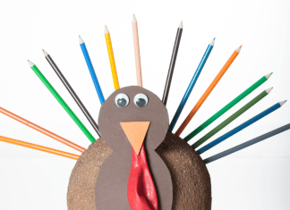 Easy Thanksgiving craft turkey made from color pencils, construction paper, and googly eyes.