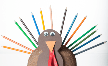 Easy Thanksgiving craft turkey made from color pencils, construction paper, and googly eyes.