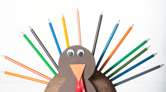 Easy Thanksgiving craft turkey made from color pencils, construction paper, and googly eyes.