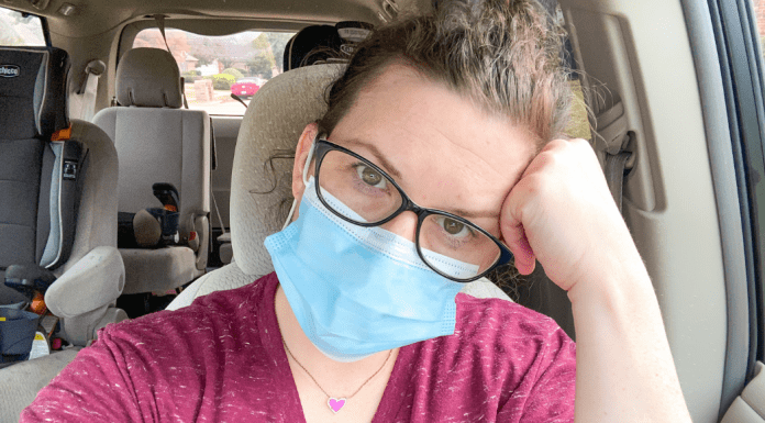 tired mom wearing mask