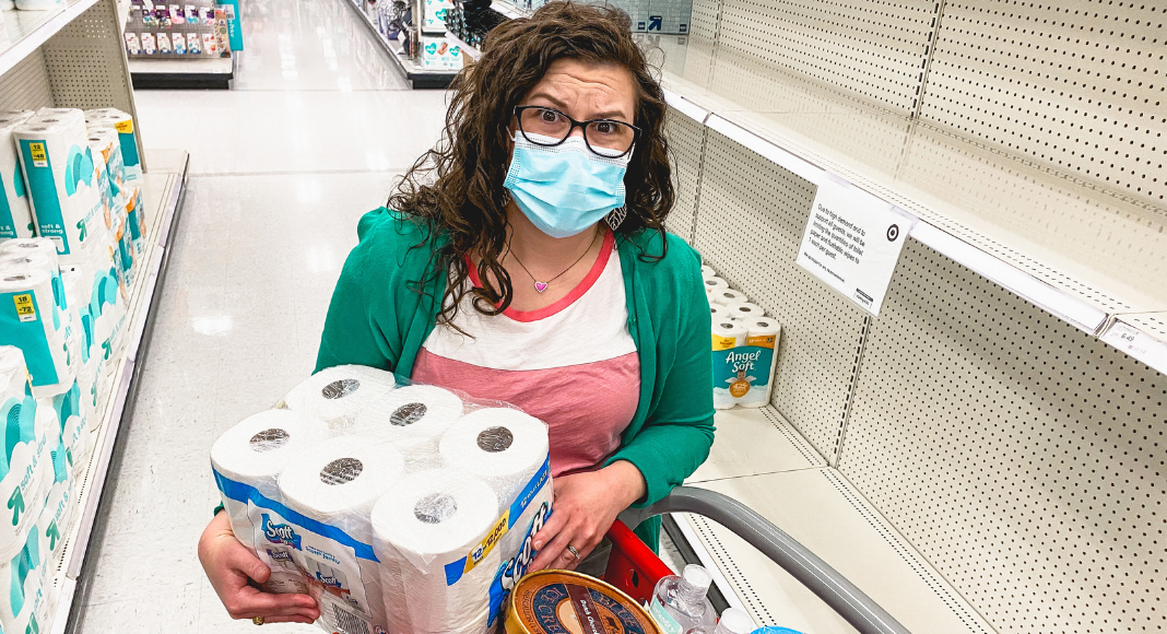 mom holding toilet paper shopping at target during covid