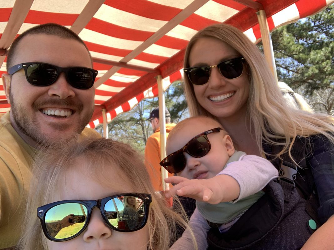 Family wearing sunglasses smiles on a staycation Collin County.