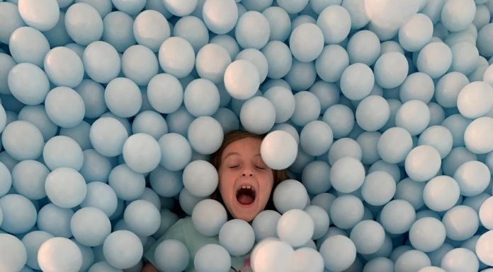 Playing in the Ball Pit at The Color Factory in New York