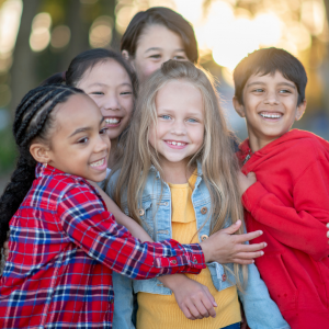 Diverse kids hugging