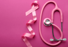 Pink breast cancer ribbon and pink stethoscope for breast cancer awareness