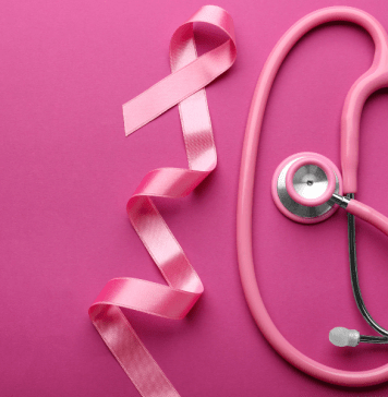 Pink breast cancer ribbon and pink stethoscope for breast cancer awareness