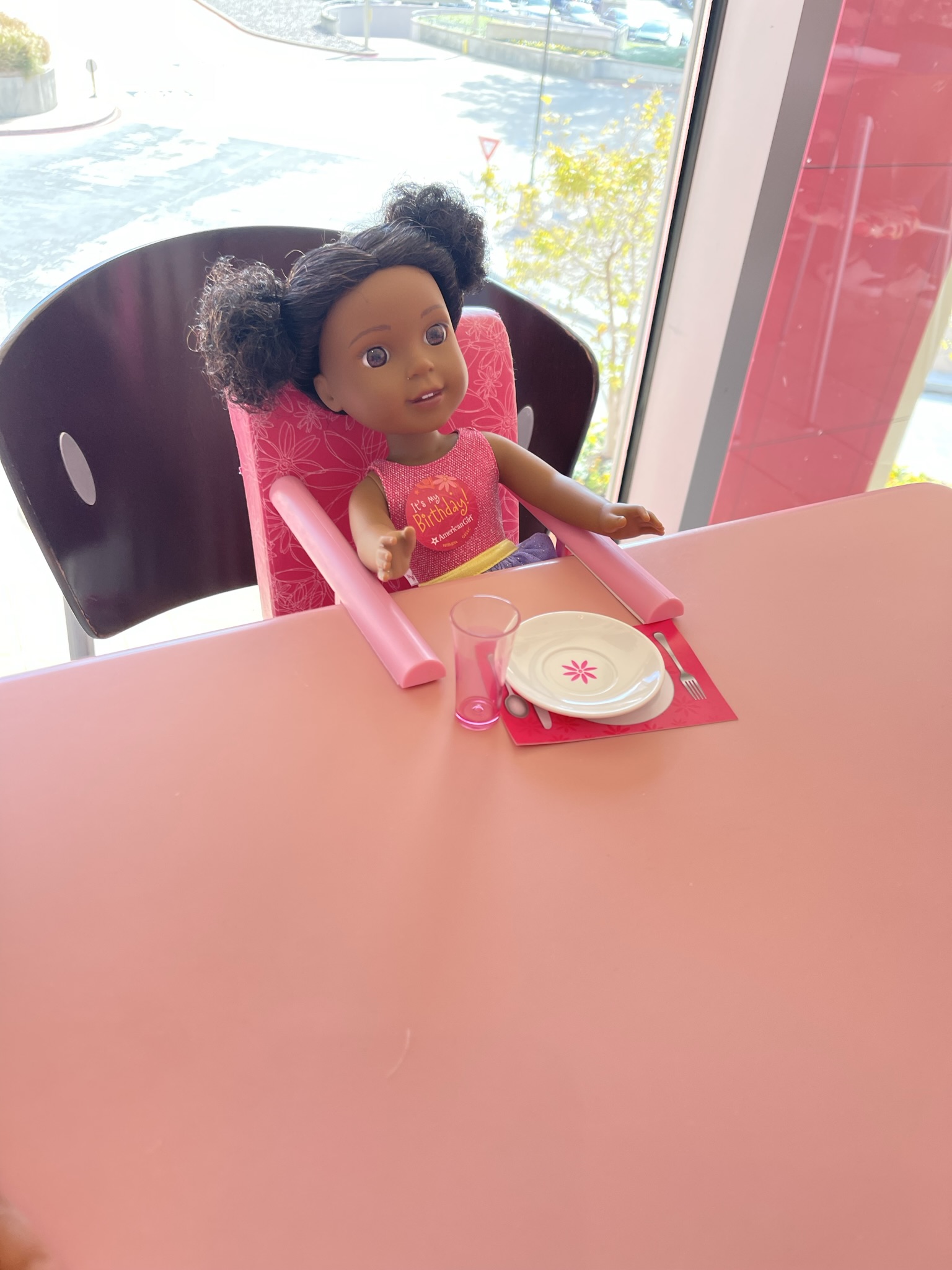 doll seated at table at the American Girl Bistro in Dallas