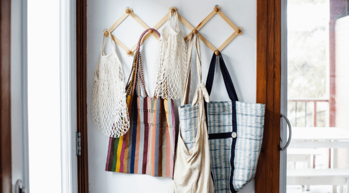 Collin County Moms: lazy mom's guide to sustainability. Picture of reusable bags hanging on hooks.