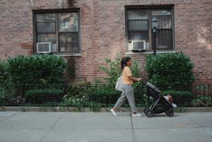 woman pushing stroller