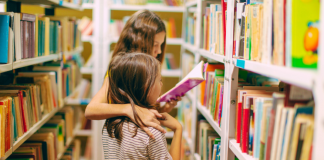 two kids reading in library, Read Across America