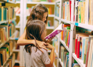 two kids reading in library, Read Across America