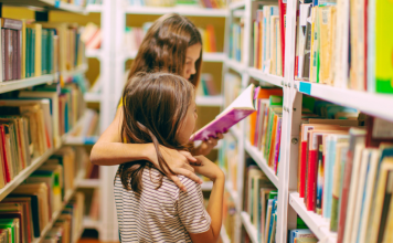 two kids reading in library, Read Across America