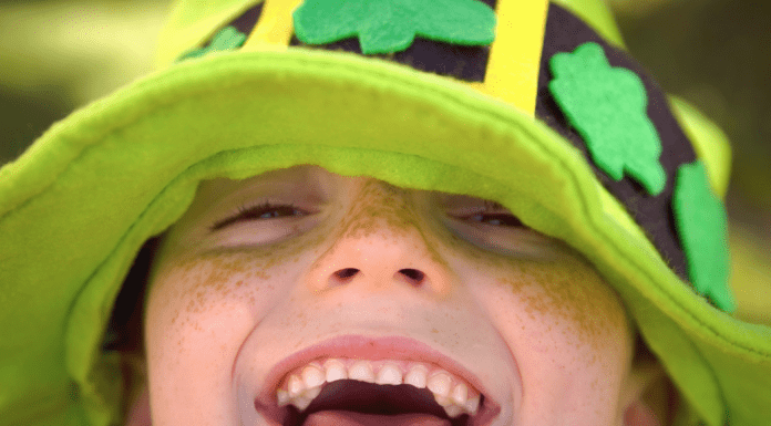 smiling child in a shamrock hat, St. Patrick's Day activities in McKinney