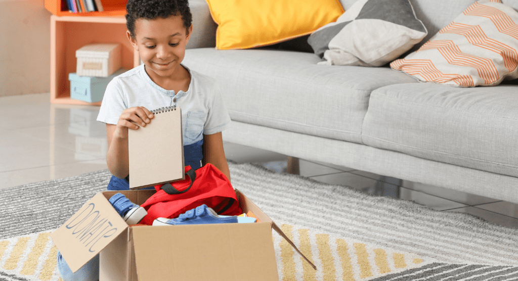 Child putting item in donation box