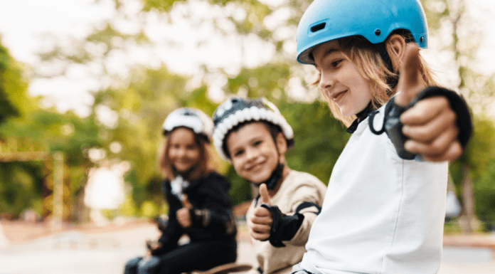 3 kids giving thumbs up in skateboarding gear, how to raise kids with a growth mindset