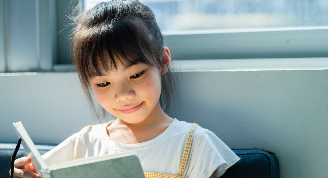 child reading, Asian American Pacific Islander Heritage Month