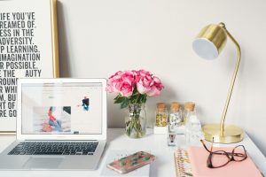 pretty desk with flowers and laptop, quit your job and change careers