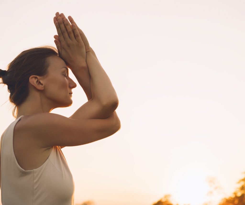 woman meditating, ways to simplify your life