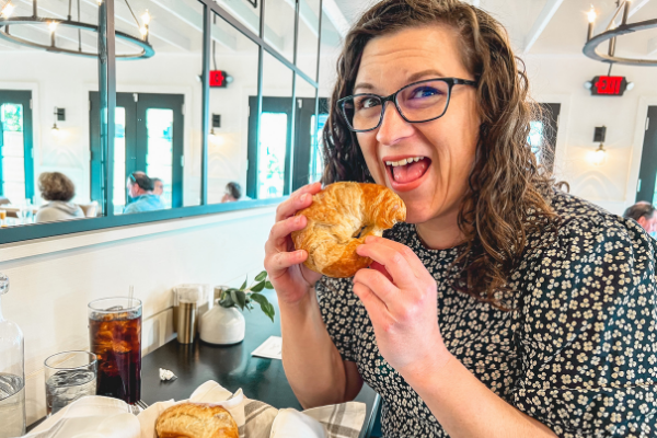 Eating a Croissant at Magnolia Table restaurant in Waco, Texas on a day trip to Magnolia Market