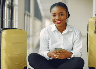 Businesswoman travels with a carry on.