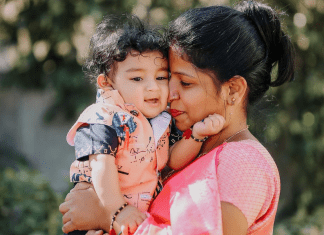 mother snuggles her baby boy's face