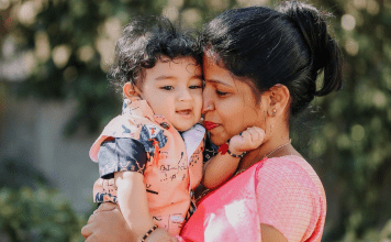 mother snuggles her baby boy's face