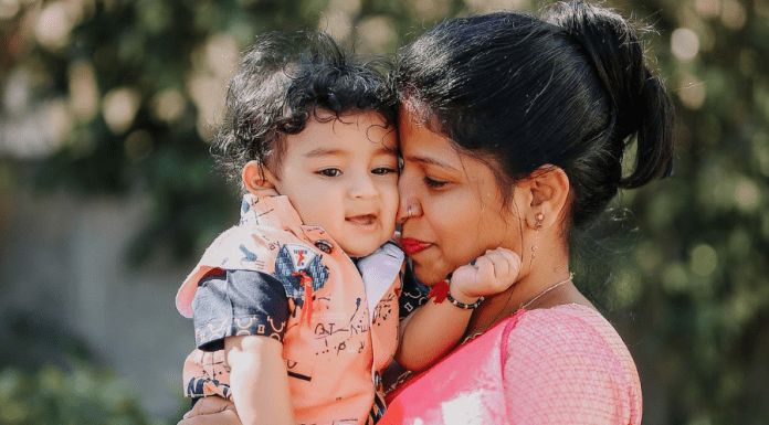 mother snuggles her baby boy's face