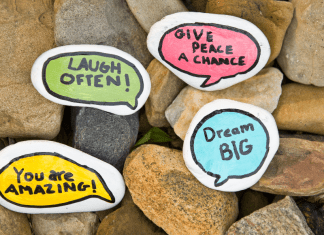 Painted rocks with sweet, kind notes like "Laugh often" and "Dream big."