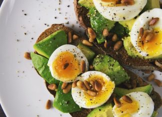 Spinach and egg salad on a plate.