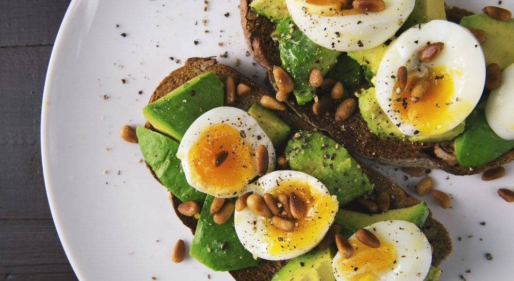 Spinach and egg salad on a plate.