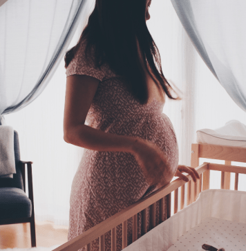 pregnant woman in nursery