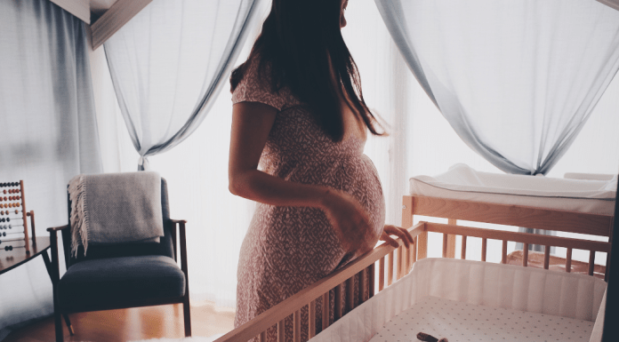 pregnant woman in nursery