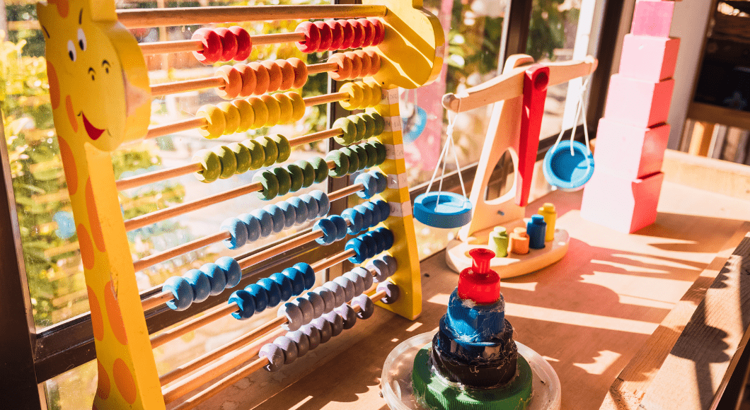 Preschool toys on a shelf.