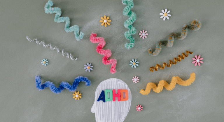 An illustration of a head with pipe cleaners coming out the top illustrating unorganized thoughts related to ADHD.