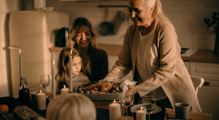 Grandmother, daughter, and granddaughter preparing holiday dinner.