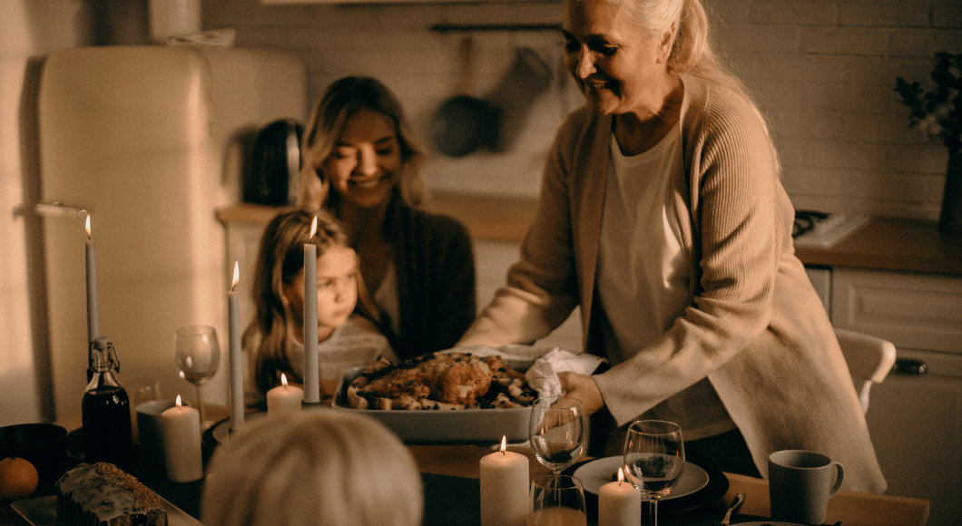 Grandmother, daughter, and granddaughter enjoying holiday dinner.