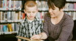 A mother reading with her son.