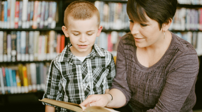 A mother reading with her son.