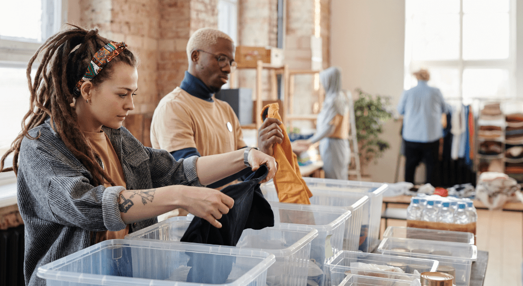 People sort through bins.