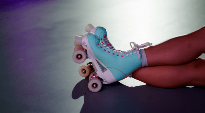 Girl roller skates with legs crossed