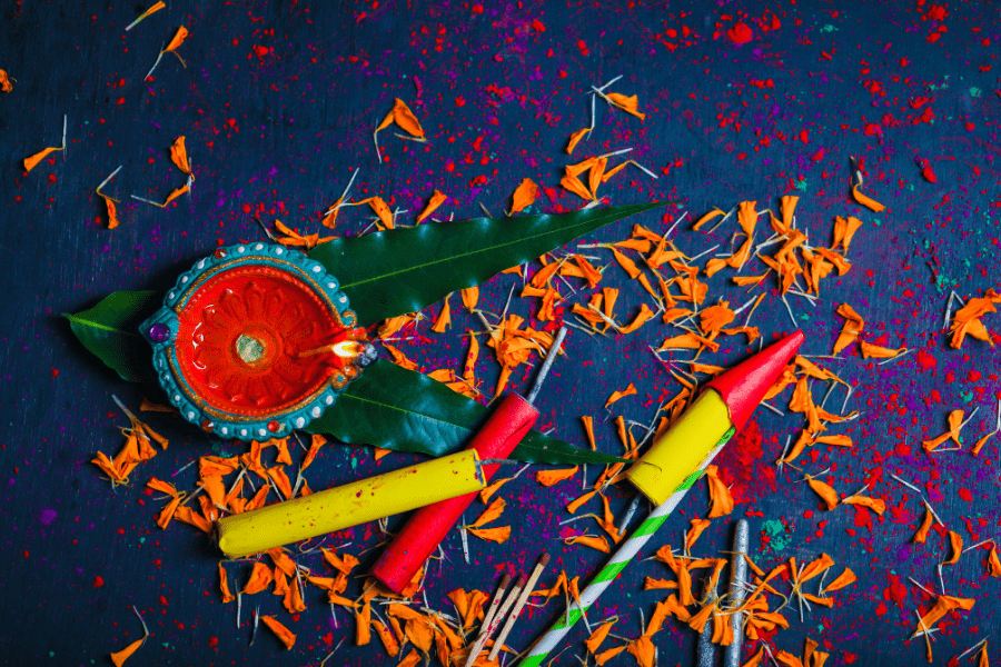 Diwali diya, confetti, and firecrackers